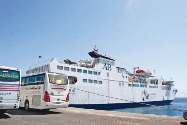 Buses beside a passenger ferry at Nuweiba port